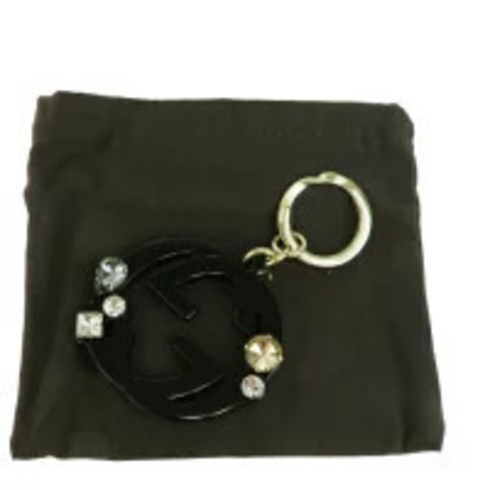 Gucci bag charm key chain interlocking rhinestones black gold
